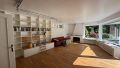 Wohnzimmer mit Einbaumöbeln